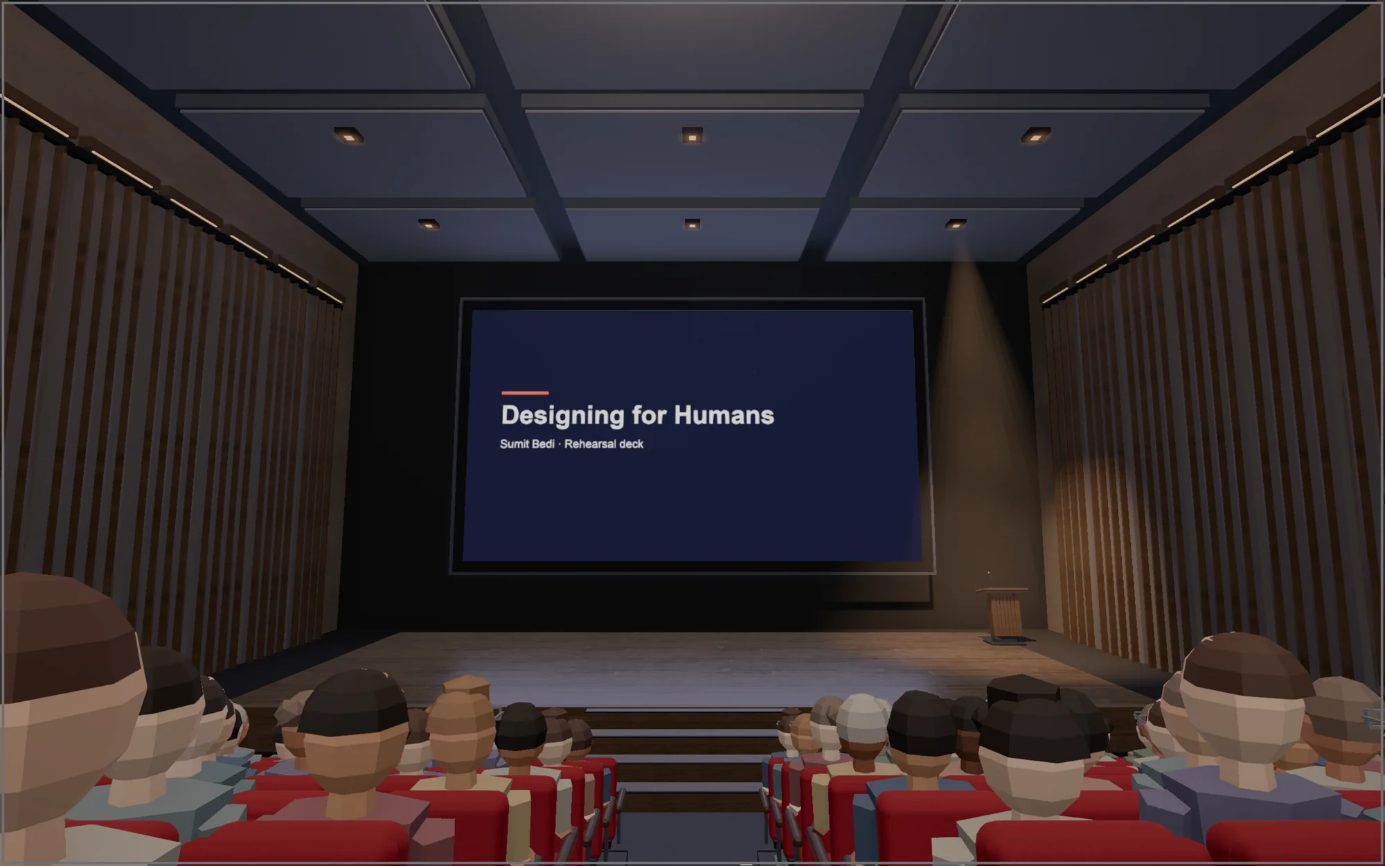 Middle of the hall, the slide on a wide screen above the stage
